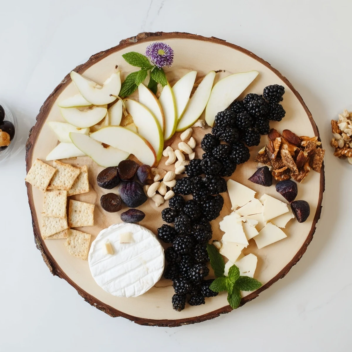 This delectable Yin-Yang Balance cheese board features sharp and creamy cheeses with lovely grapes.