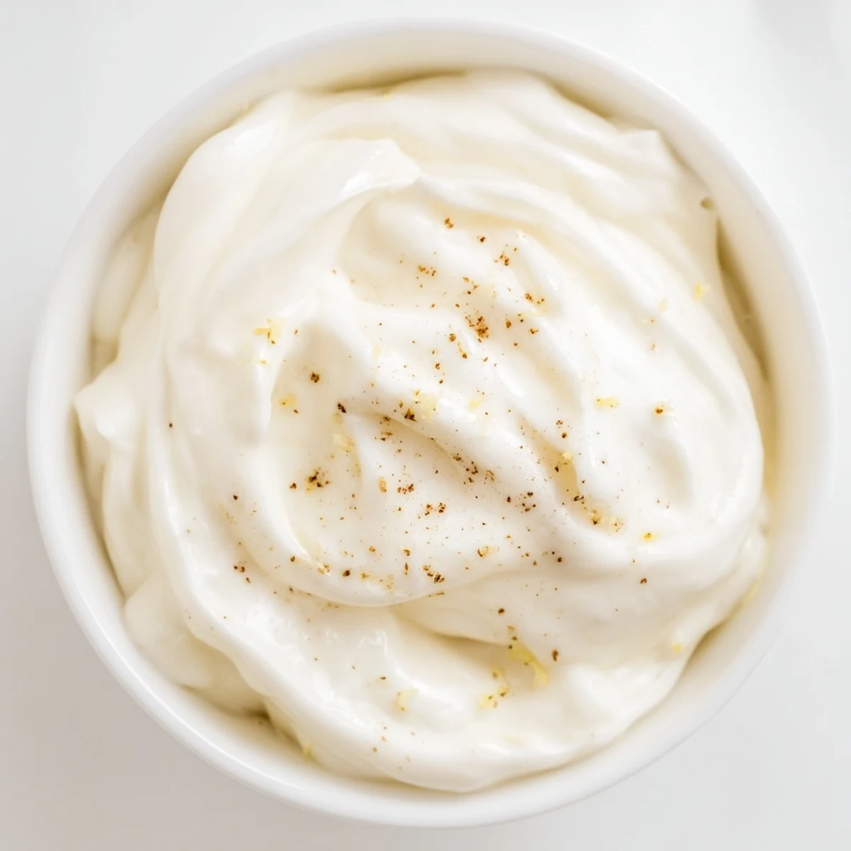 A close-up of a luscious Greek Yogurt Fruit Dip, swirled and ready to be served for healthy snacks.