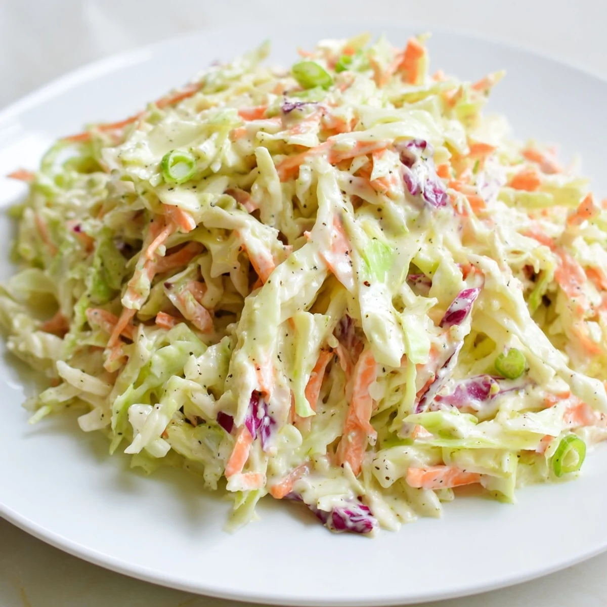 Enjoy this simple Quick Coleslaw Salad; a flavorful, refreshing side with hints of apple cider and mustard.