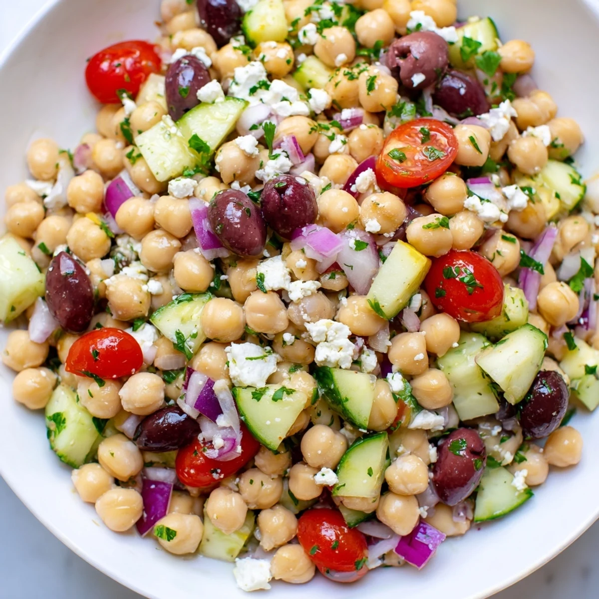 Mediterranean Chickpea Salad: A colorful bowl of chickpeas, vegetables, and feta, ready to eat!