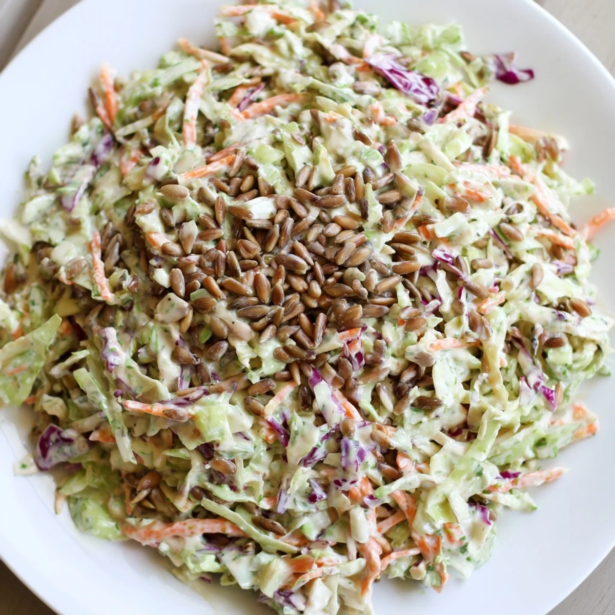 Fresh crunchy coleslaw salad with vibrant shredded cabbage, carrots, and creamy dressing.