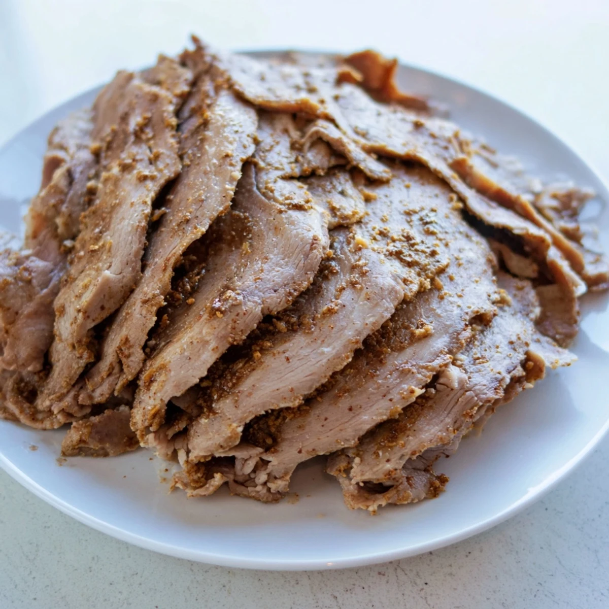 Mouthwatering Turkish Döner Meat, thinly sliced and ready to be served in warm pita bread.