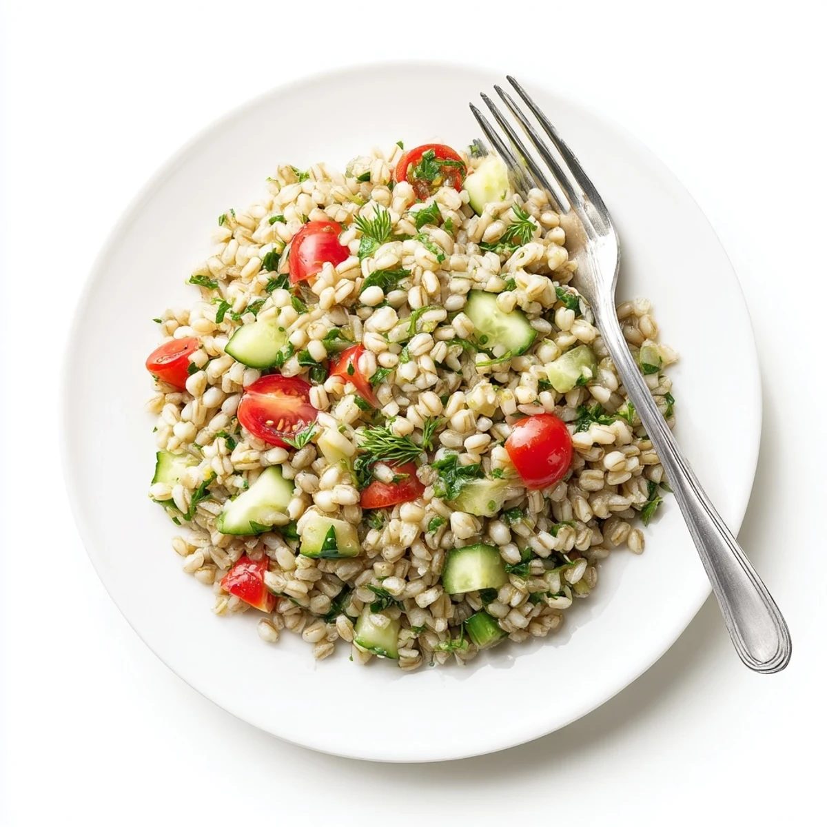 Close-up of a chilled Barley and Herb Salad bowl highlighting the nutty barley texture, diced red onion, and glistening olive oil dressing.
