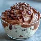 Creamy cottage cheese chocolate mousse, topped with berries, a guilt-free sweet treat.