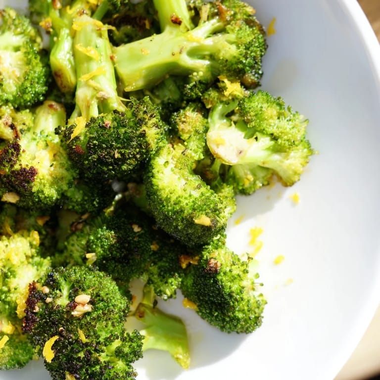 Tender florets of Lemon Garlic Roasted Broccoli are tossed with garlic and lemon zest, ready to serve.